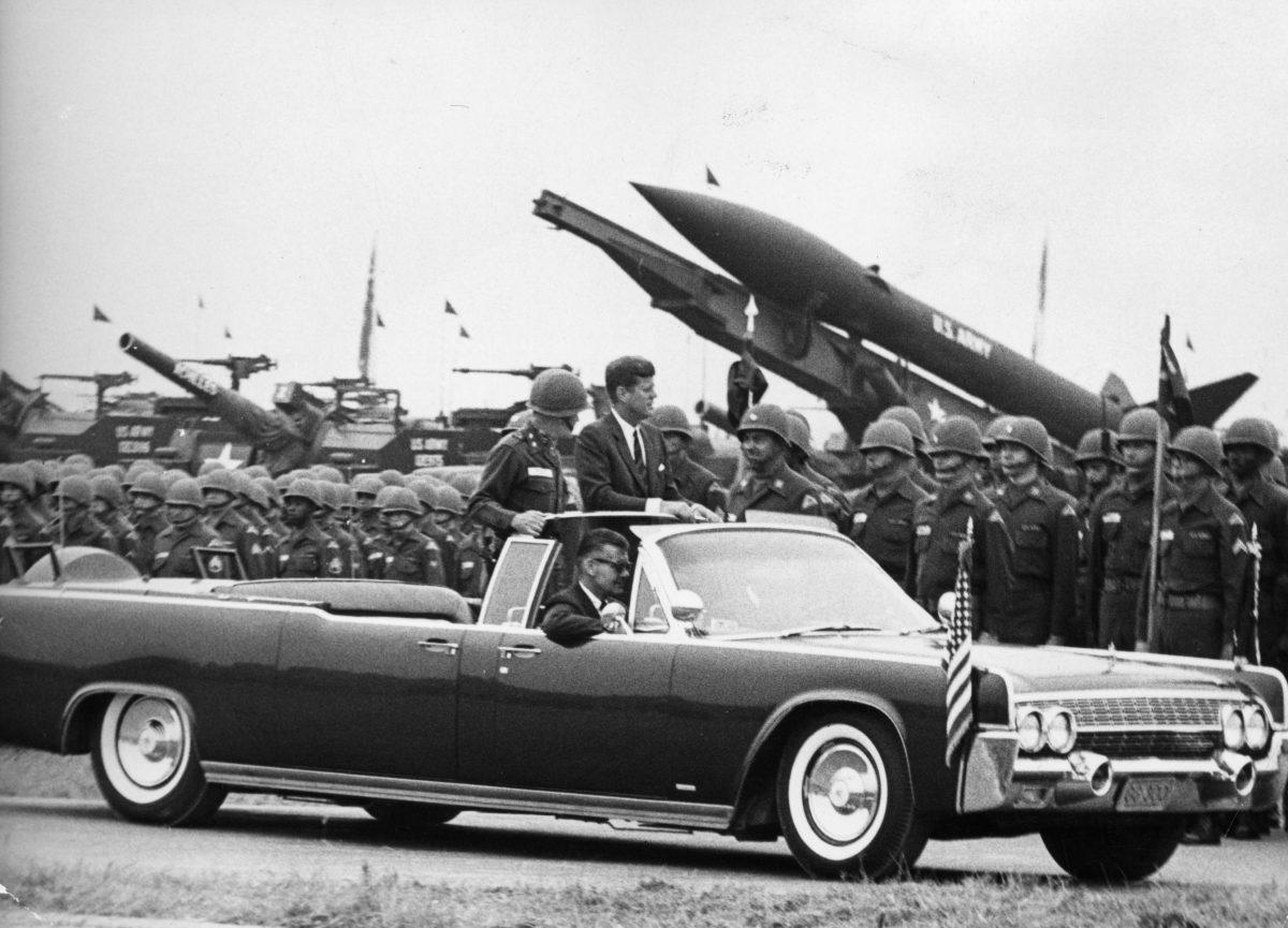 President John F. Kennedy reviewing troops and weaponry from a stretch limousine during an inspection at Hanau in Germany on  June 25, 1963. (Keystone/Getty Images)