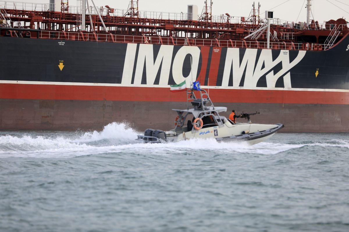 A speedboat of the Iran's Revolutionary Guard moves around a British-flagged oil tanker Stena Impero which was seized in the Strait of Hormuz by the Guard, in the Iranian port of Bandar Abbas, on July 19 2019. (Morteza Akhoondi/Mehr News Agency via AP)