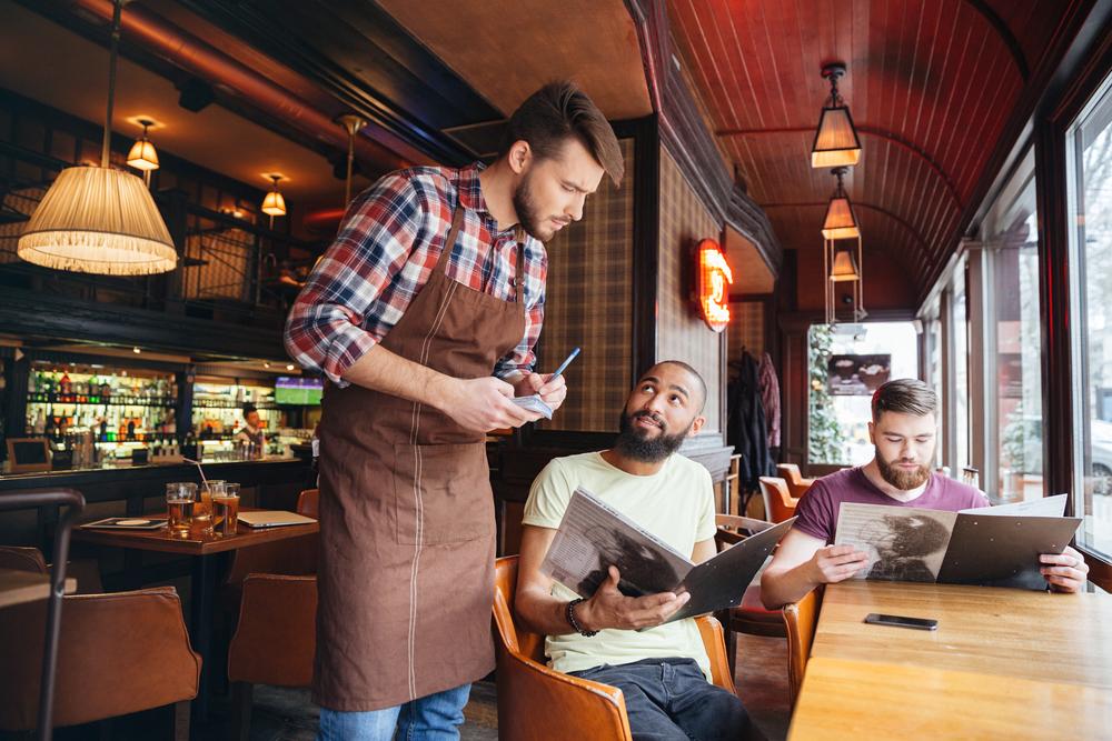 Illustration - Shutterstock | <a href="https://www.shutterstock.com/image-photo/serious-concentrated-young-waiter-standing-taking-521293192?src=ypbG3PXPm9nVKJORNUa2pg-1-15&studio=1">Shift Drive</a>