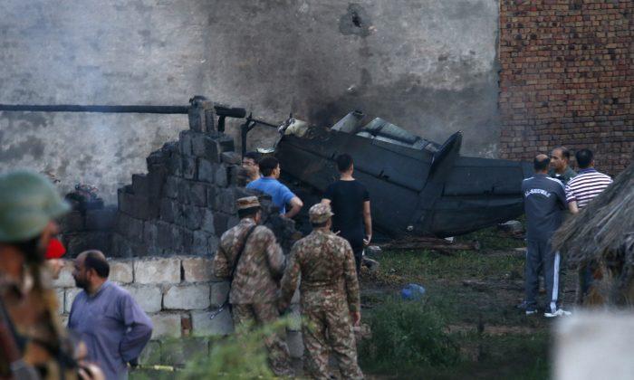 Pakistani Army Plane Crashes Into Homes, Killing at Least 18