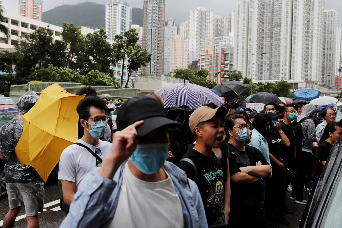 Supporters gather outside the Eastern Courts to support the arrested anti-extradition bill protesters who face rioting charges, in Hong Kong, China on July 31, 2019. (Tyrone Siu/Reuters)