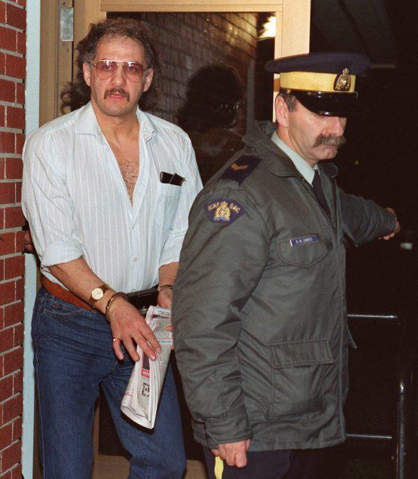 Allan Legere leaves court in Burton, New Brunswick, as he waits for jurors in his murder trial to return a verdict, on Nov. 2, 1991. (Andrew Vaughan/The Canadian Press)