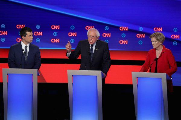 Democratic presidential candidates Sen. Bernie Sanders (D-Vt.) (C) speaks while Sen. Elizabeth Warren (D-Mass.) and South Bend, Indiana, Mayor Pete Buttigieg (L) listen at the beginning of the Democratic Presidential Debate in Detroit, Mich., at the Fox Theatre on July 30, 2019. (Justin Sullivan/Getty Images)
