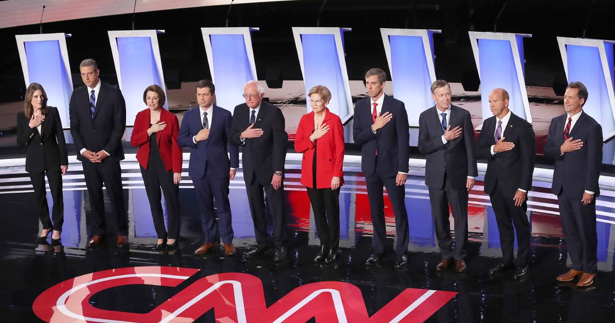 Democratic presidential candidates Marianne Williamson, (L-R), Rep. Tim Ryan (D-OH), Sen. Amy Klobuchar (D-MN), Indiana Mayor Pete Buttigieg, Sen. Bernie Sanders (I-VT), Sen. Elizabeth Warren (D-MA), former Texas congressman Beto O'Rourke, former Colorado Governor John Hickenlooper, former Maryland congressman John Delaney, and Montana Gov. Steve Bullock take the stage at the beginning of the Democratic Presidential Debate at the Fox Theatre in Detroit, Michigan on July 30, 2019. 20 Democratic presidential candidates were split into two groups of 10 to take part in the debate sponsored by CNN held over two nights at Detroit’s Fox Theatre. (Justin Sullivan/Getty Images)