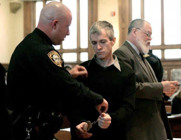 Serial killer nurse Charles Cullen, has handcuffs put on by a court officer after Cullen's sentencing in Somerville, N.J., March 2, 2006. (AP Photo/Mike Derer, Pool)