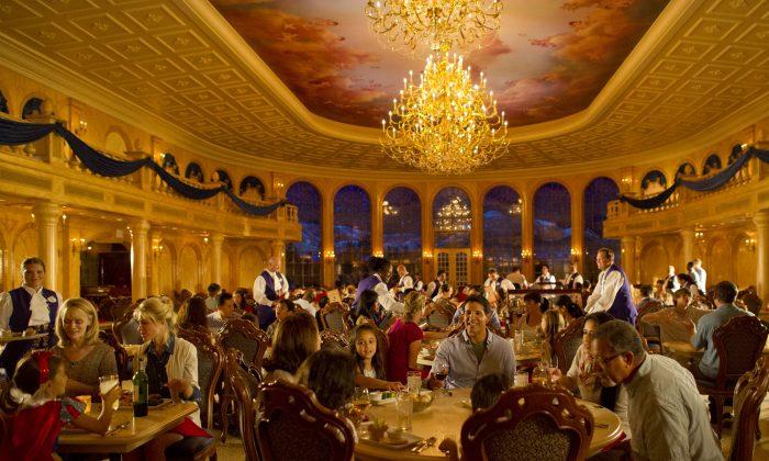 Decorated with a coffered, 20-foot ceiling, the ballroom at Be Our Guest Restaurant features sparkling chandeliers designed to convey the elegance of Beast's castle from the animated feature film. (Matt Stroshane/Disney)