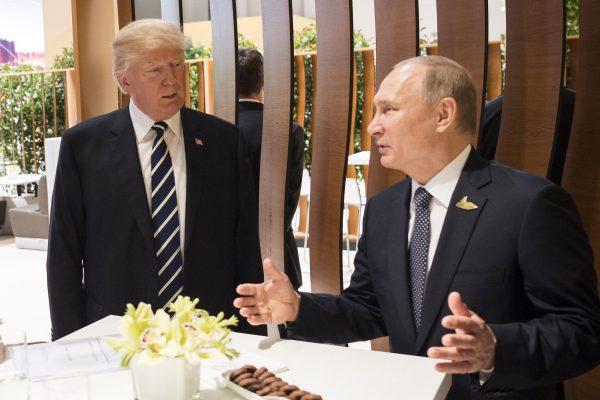 In this photo provided by the German Government Press Office (BPA), Donald Trump, President of the USA (C) meets Vladimir Putin, President of Russia during the G20 Summit in Hamburg, Germany on July 7, 2017. (BPA via Getty Images)