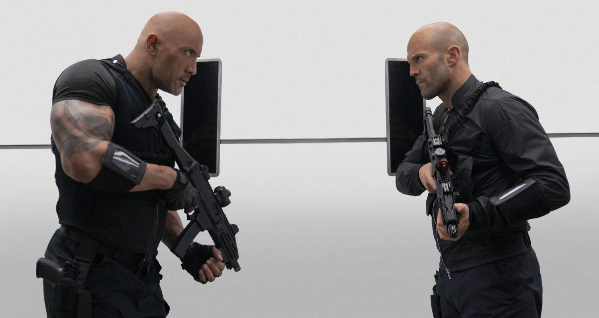 Dwayne Johnson (L) (<em>would you look at the size of that Johnson arm?)</em> and Jason Statham in “Fast & Furious Presents: Hobbs & Shaw.” (Daniel Smith/Universal Pictures)