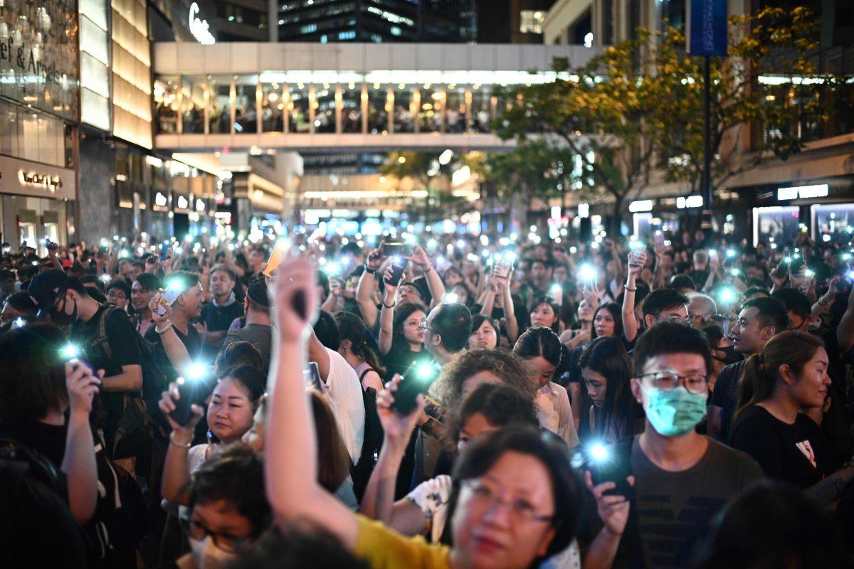 People attend a protest held by civil servants in the Central District of Hong Kong on Aug. 2, 2019. (Anthony Wallace/AFP/Getty Images)