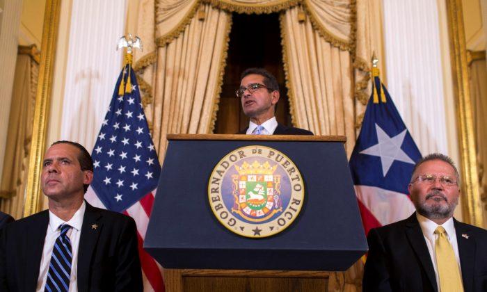 Puerto Rico Governor Resigns as Promised; Successor Sworn In