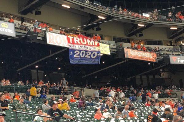 Trump supporters drop their huge re-elect Trump 2020 "Keep America Great" banner at the Baltimore Orioles game at Camden Yards in Baltimore, My. on August 1, 2019. (Courtesy of Dion Cini)