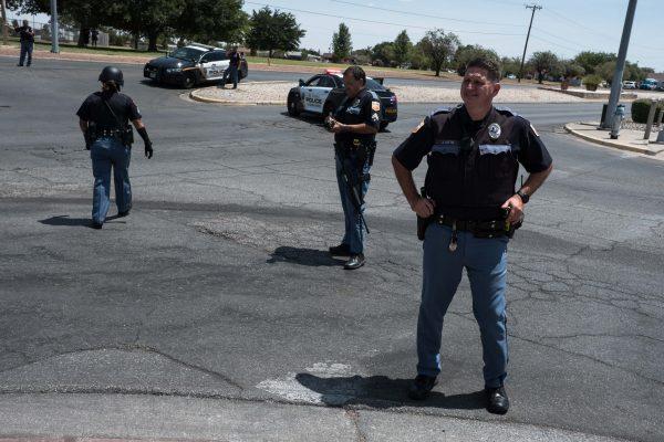 Law enforcement agencies respond to an active shooter at a Wal-Mart near Cielo Vista Mall in El Paso, Texas, Saturday, Aug. 3, 2019. - Police said there may be more than one suspect involved in an active shooter situation Saturday in El Paso, Texas. City police said on Twitter they had received "multi reports of multipe shooters." There was no immediate word on casualties. (Joel Angel Juarez/AFP/Getty Images)