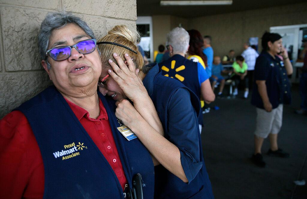 Walmart employees react after an active shooter opened fire at the store in El Paso, Texas, on Aug. 3, 2019. (Mark Lambie/The El Paso Times via AP)