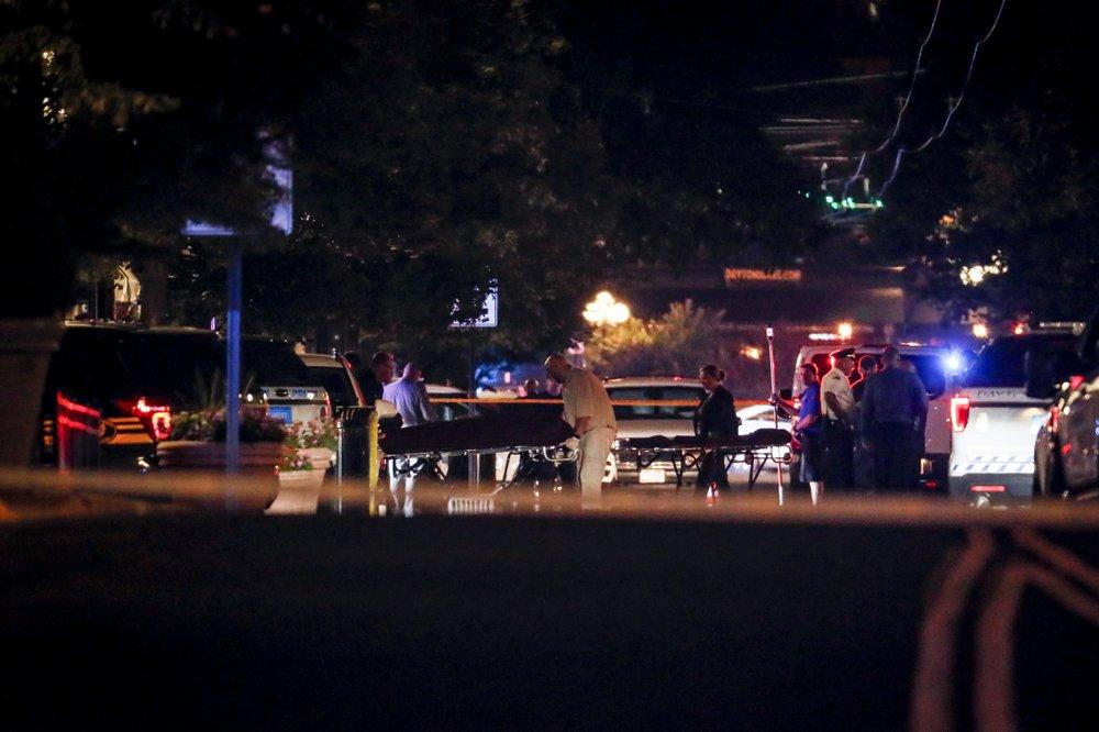 Bodies are removed from at the scene of a mass shooting Aug. 4, 2019, in Dayton, Ohio. (AP Photo/John Minchillo)