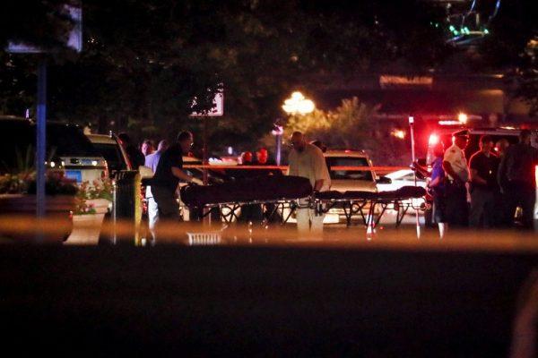 Bodies are removed from at the scene of a mass shooting in Dayton, Ohio on Aug. 4, 2019. (AP Photo/John Minchillo)