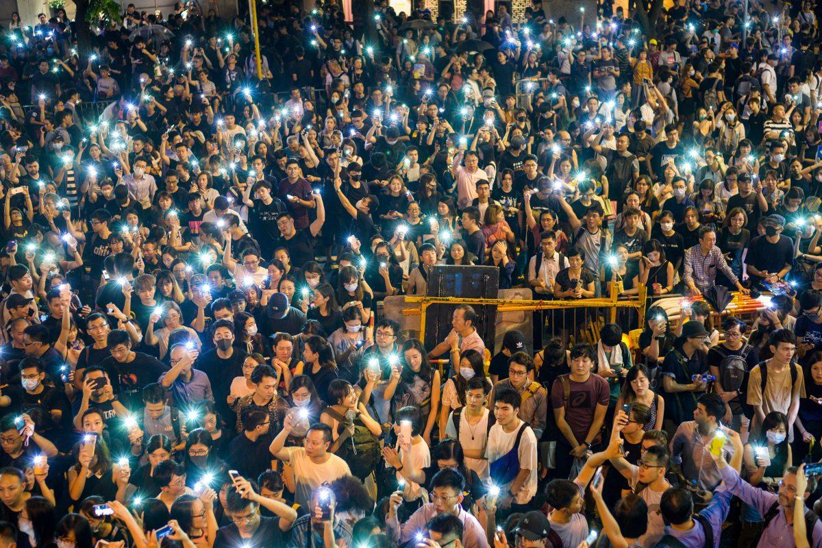 People attend a protest held by civil servants in the Central District of Hong Kong on Aug. 2, 2019. (Anthony Wallace/AFP/Getty Images)
