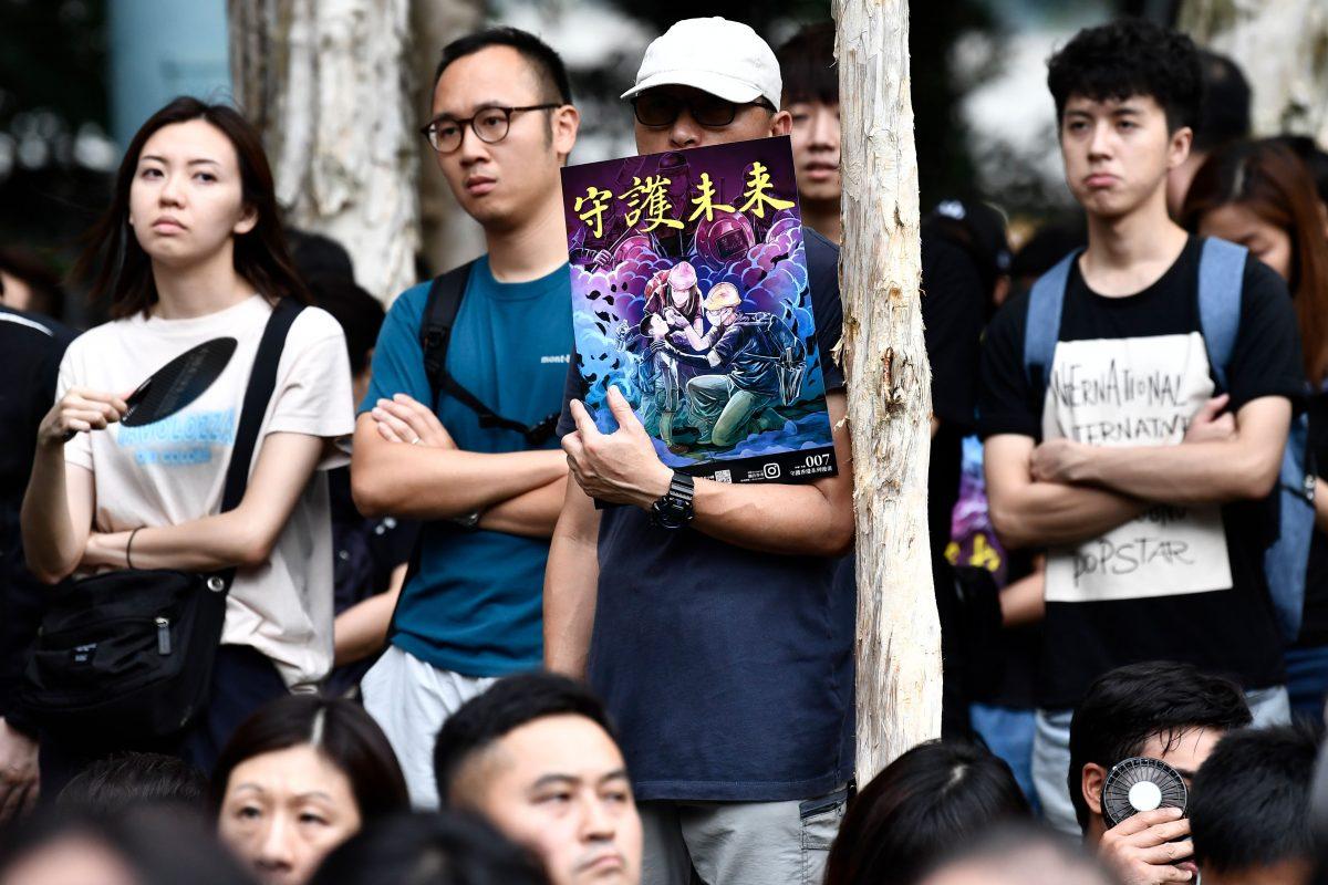 People attend a protest in the Western district of Hong Kong on Aug. 4, 2019. The poster in the center reads: "Safeguard the Future." (Anthony Wallace/AFP/Getty Images)