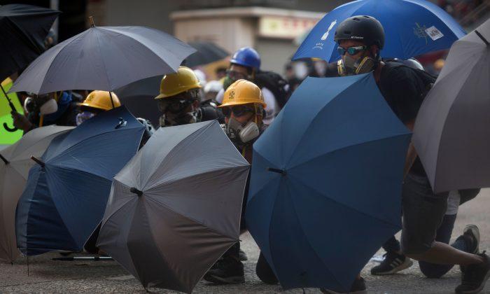 Hongkongers Hold Strike Despite Similarly Worded Stern Warnings by Hong Kong, Beijing Authorities