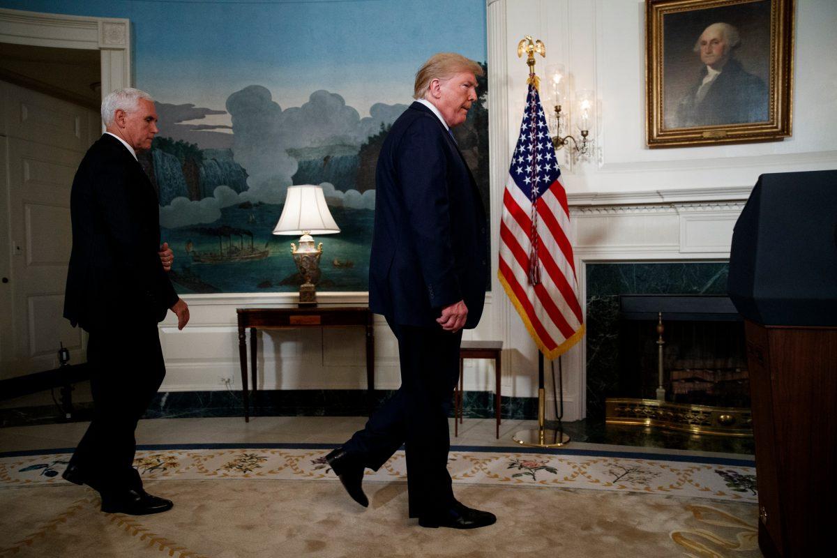 Vice President Mike Pence follows President Donald Trump as he arrives to speak about the mass shootings in El Paso, Texas and Dayton, Ohio, in the Diplomatic Reception Room of the White House, in Washington, on Aug. 5, 2019. (Evan Vucci/AP Photo)