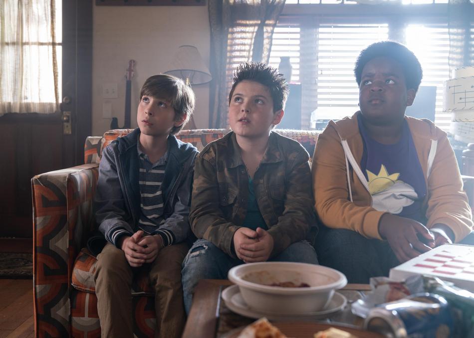 (L–R) Jacob Tremblay, Brady Noon, and Keith L. Willams trying to buy drugs in a frat house, in "Good Boys." (Universal Pictures)