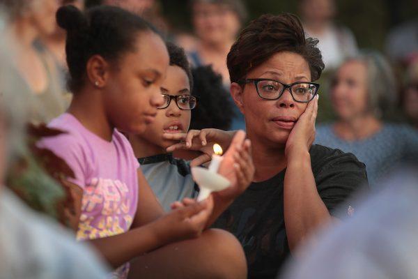 Mourners attend a memorial service to remember the victims of Sunday morning's mass shooting in the Oregon District of nearby Dayton in Springfield, Ohio, on Aug. 5, 2019. (Scott Olson/Getty Images)