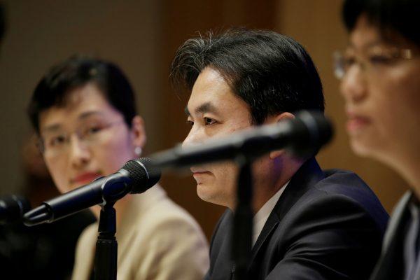 Yang Guang (C) and Xu Luying (R) of the Hong Kong and Macau Affairs Office of the State Council attend a news conference on the current situation in Hong Kong, in Beijing, China, Aug. 6, 2019. (Reuters/Jason Lee)