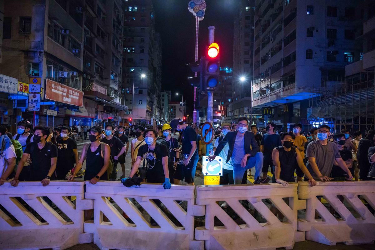 Protestors stand off against riot police after a student's arrest at Sham Shui Po district on Aug. 6, 2019 in Hong Kong, China. (Billy H.C. Kwok/Getty Images)