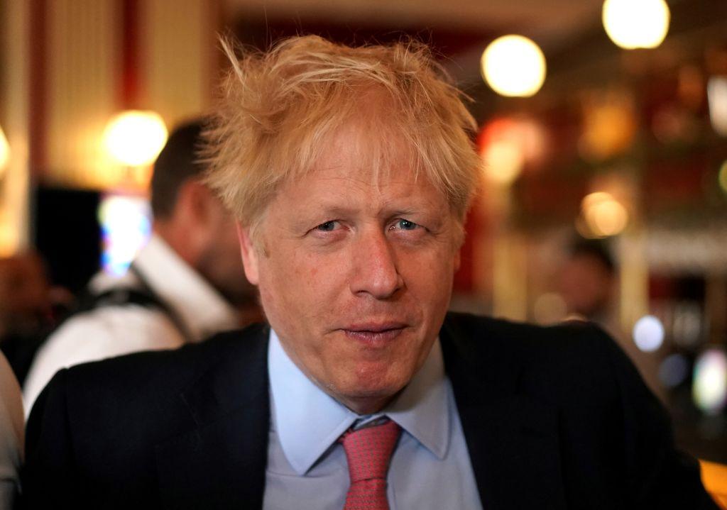 Just as Winston Churchill was known by his signature cigar, Boris Johnson has his own trademark: unkempt hair. (Henry Nicholls/ AFP/Getty Images)