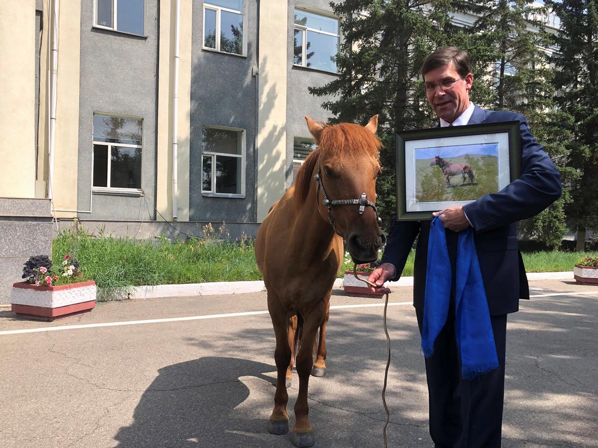 U.S. Secretary of Defense Mark Esper is gifted a horse in Ulan Bator, Mongolia on Aug. 8, 2019. (Idrees Ali/Reuters)