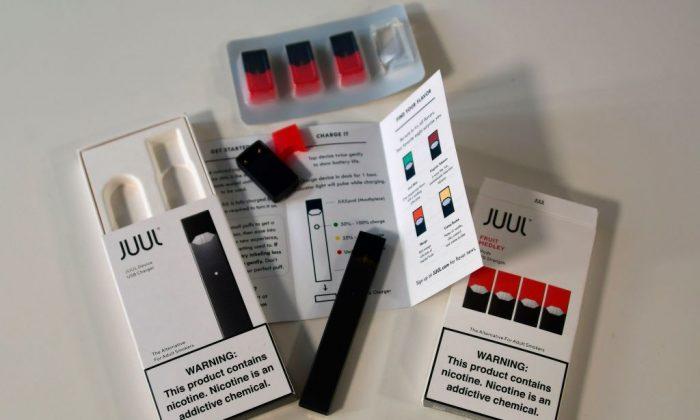 An illustration shows the contents of an electronic Juul cigarette box in Washington, on Oct. 2, 2018. (Eva Hambach/AFP/Getty Images)