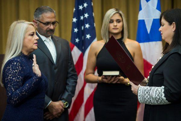 Justice Secretary Wanda Vazquez (L) is sworn in as governor of Puerto Rico by Supreme Court Justice Maite Oronoz, in San Juan, Puerto Rico, on Aug. 7, 2019. (Dennis M. Rivera Pichardo/AP Photo)