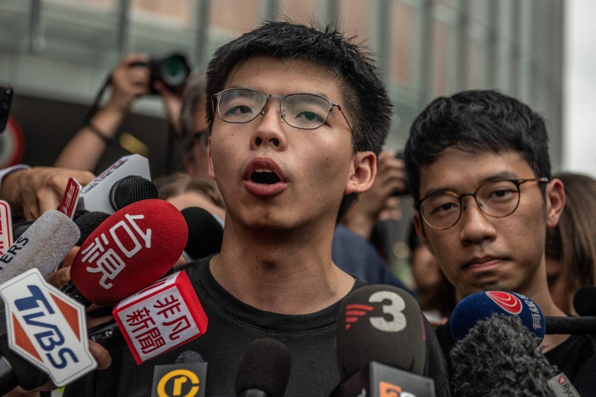 Pro-democracy activist Joshua Wong speaks to the media outside the Legislative Council shortly after being released from prison in Hong Kong on June 17, 2019. (Carl Court/Getty Images)