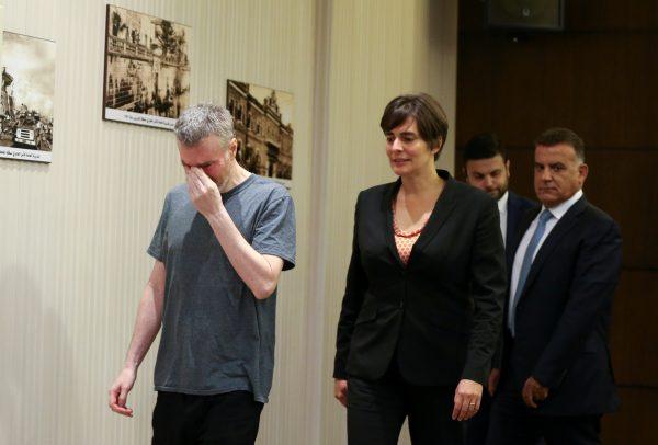 Canadian citizen, Kristian Lee Baxter, who was being held in Syria reacts as he walks next to Canadian Ambassador to Lebanon, Emmanuelle Lamoureux and Major General Abbas Ibrahim, Lebanon's internal security chief, after being released, in Beirut, Lebanon August 9, 2019. (Mohamed Azakir/Reuters)