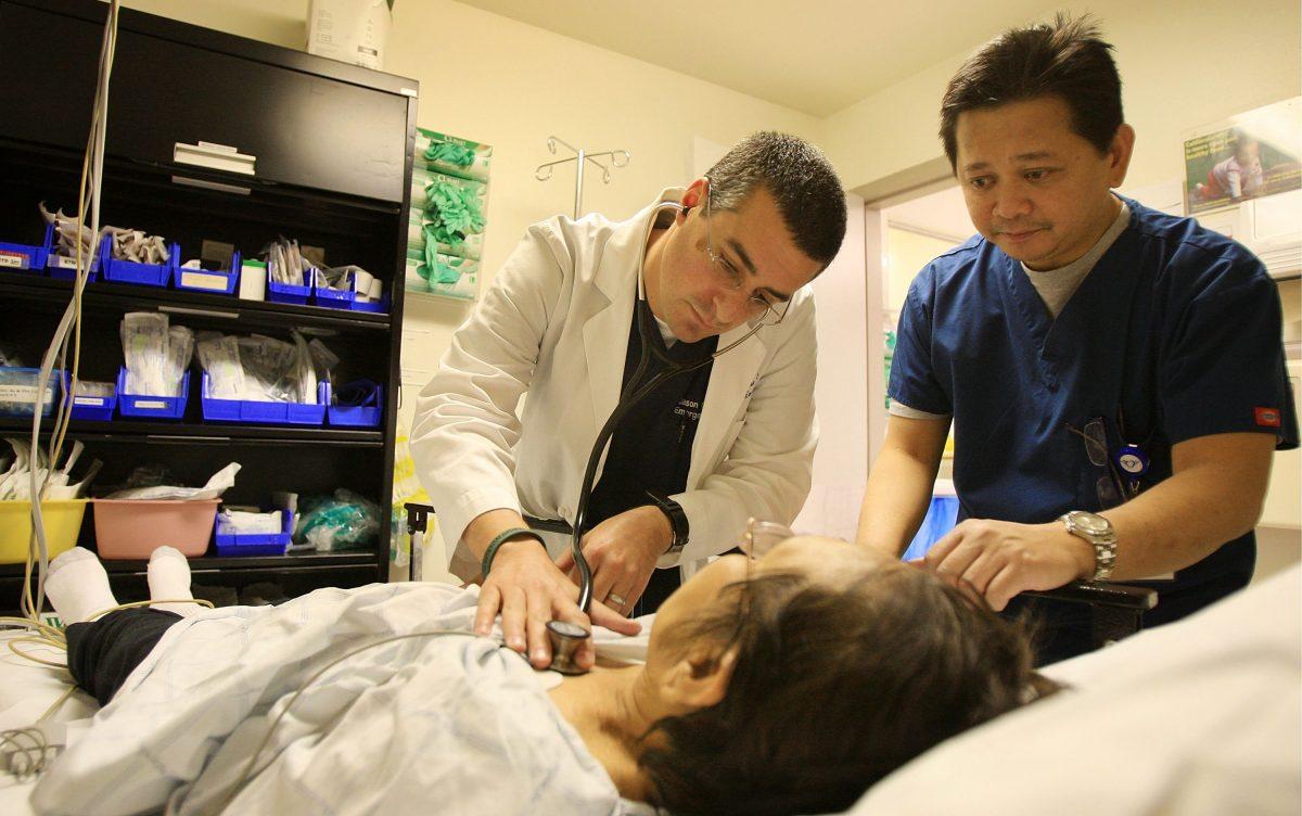 A doctor and emergency room nurse care for a patient at Mission Community Hospital in Panorama City, Calif., on Jan. 28, 2009. (David McNew/Getty Images)