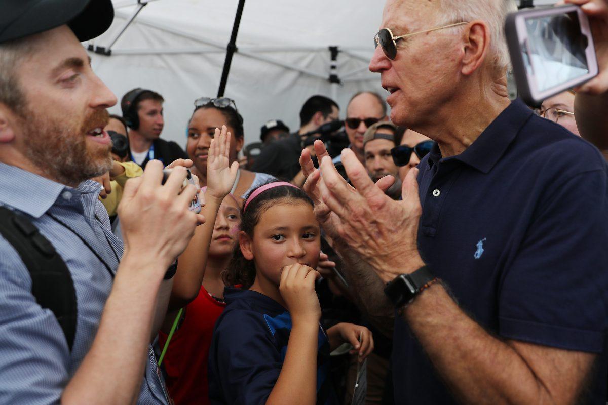 Democratic presidential candidate and former Vice President Joe Biden, right, talks with Joel Pollak of Breitbart News, during the Iowa State Fair in Des Moines, Iowa on Aug. 8, 2019. (Chip Somodevilla/Getty Images)