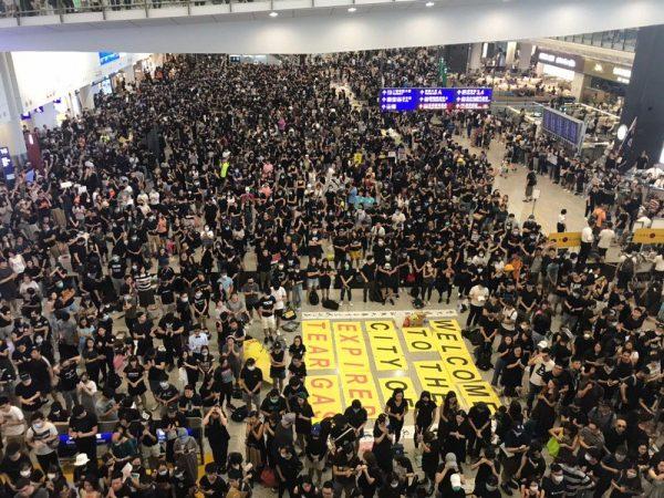 Thousands gathered at the arrival hall at the Hong Kong International Airport for a sit-in protest on Aug. 10, 2019. (Thomas Lam/The Epoch Times)
