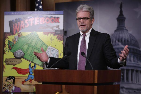 Sen. Tom Coburn (R-Okla.) announces the release of  "Wastebook 2013," his annual report of "examples of wasteful and low-priority spending" of the U.S. Government, at a news conference on Capitol Hill in Washington on Dec. 17, 2013. (Alex Wong/Getty Images)