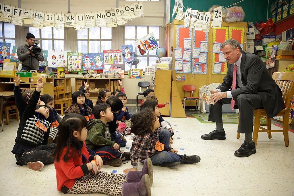 New York City Mayor Bill de Blasio talks with children after reading them a book in a pre-kindergarten class at P.S. 130 on Feb. 25, 2014 in New York City. (Seth Wenig-Pool/Getty Images)