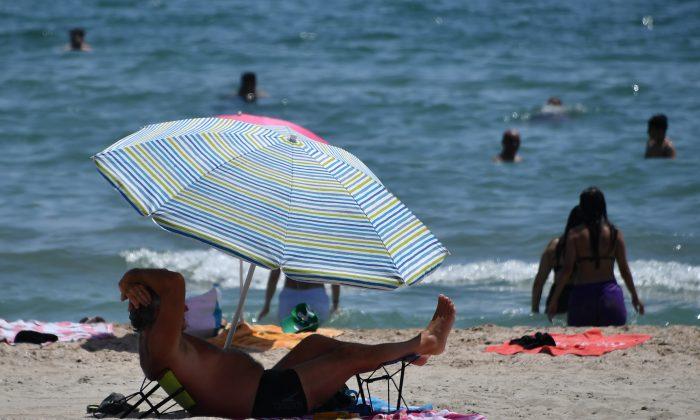 Teenager Impaled by Flying Umbrella at Beach, Rushed to Hospital