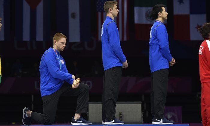 American Gold Medalists Kneel, Raise Fist During National Anthem, Face Punishment