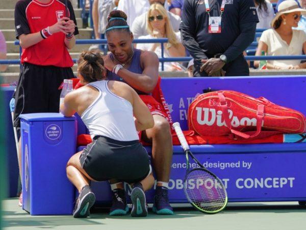 Bianca Andreescu (L) tries to console Serena Williams (R) after she withdrew from the championship match during the Rogers Cup tennis tournament at Aviva Centre in Toronto, Canda, on Aug. 11, 2019. (John E. Sokolowski/USA TODAY Sports)