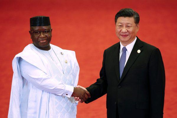 Sierra Leone President Julius Maada Bio shakes hands with Chinese leader Xi Jinping during the Forum on China-Africa Cooperation at the Great Hall of the People in Beijing on Sept. 3, 2018. (Andy Wong/AFP/Getty Images)