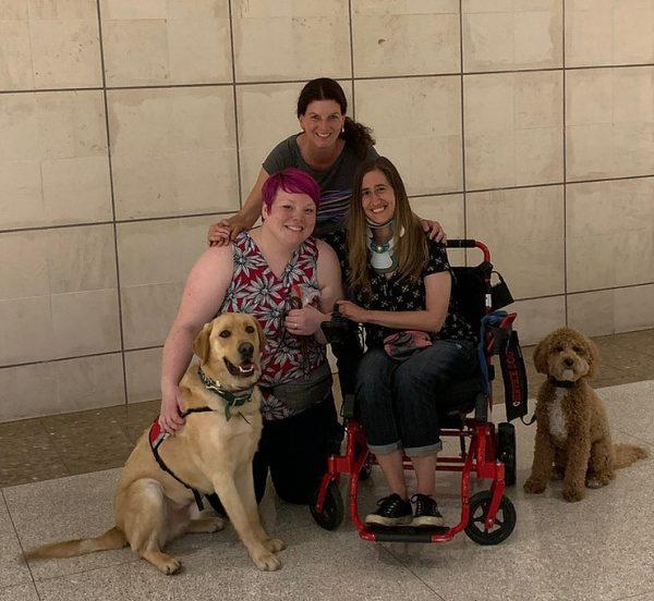 Katie Harris (R) with the service dog (L) they plan to gift to someone who can't afford one. (Courtesy of Katie Harris)
