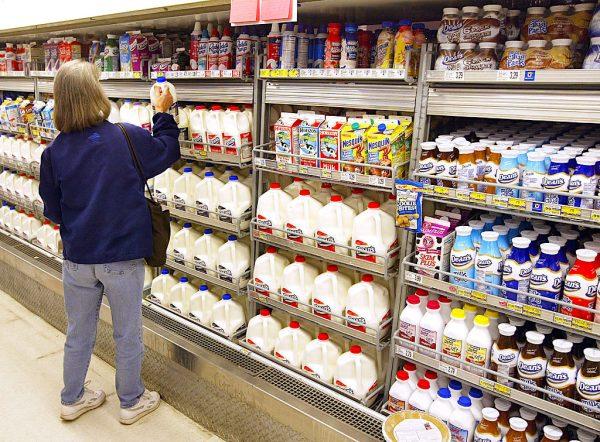 A woman shops for milk in a grocery store in Chicago, Ill. on April 12, 2004. (Tim Boyle/Getty Images)