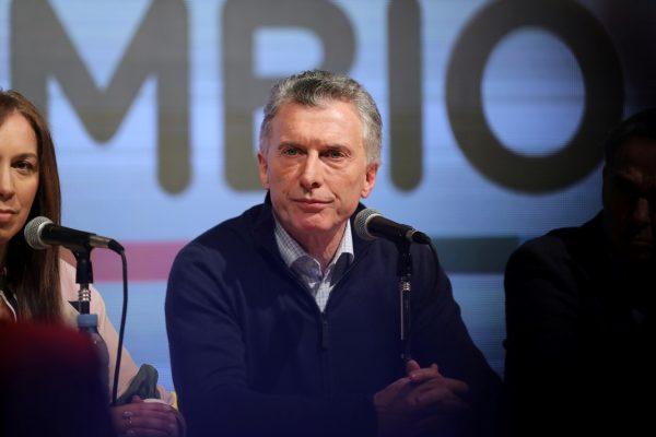 Argentina's incumbent President and presidential candidate Mauricio Macri is seen on stage during the primary elections, at a convention centre in Buenos Aires, Argentina, on Aug. 11, 2019. (Luisa Gonzalez/Reuters)