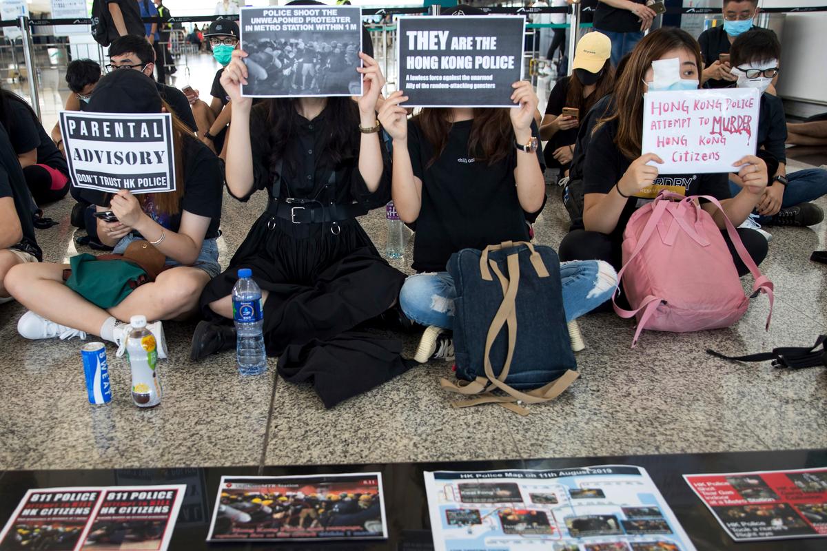 Protesters stage a sit-in rally at the departure hall of the Hong Kong International Airport in Hong Kong, China on Aug. 13, 2019. (Vincent Thian/AP)
