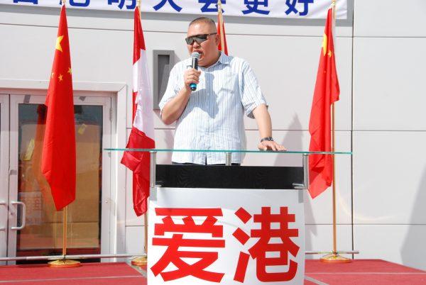 Wei Chengyi speaks at a rally in Markham, Ont., on Aug. 11, 2019, condemning the protests in Hong Kong. (Yi Ling/The Epoch Times)