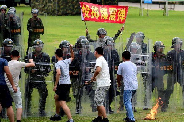 Chinese paramilitary police officers take part in anti-riot training exercises in Shenzhen city of southern China's Guangdong province on June 5, 2017. (STR/AFP/Getty Images)