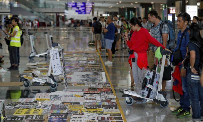 Flights Restart at Hong Kong Airport as Protesters Apologize