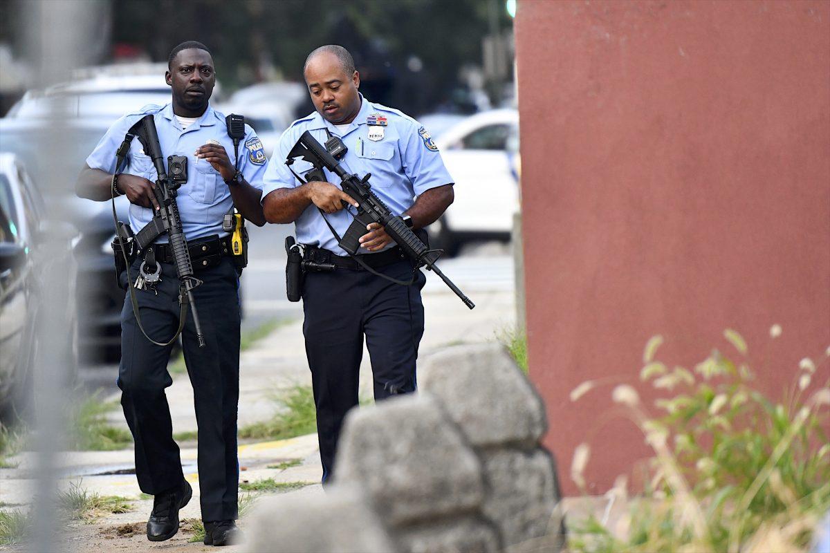 Police officers carrying assault rifles respond to a shooting in Philadelphia, Pennsylvania on Aug. 14, 2019. (Mark Makela/Getty Images)